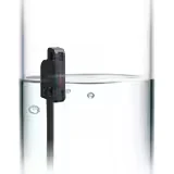 Unidad de fibra Keyence FU-95W montada en un tubo transparente de gran diámetro dentro de un vaso