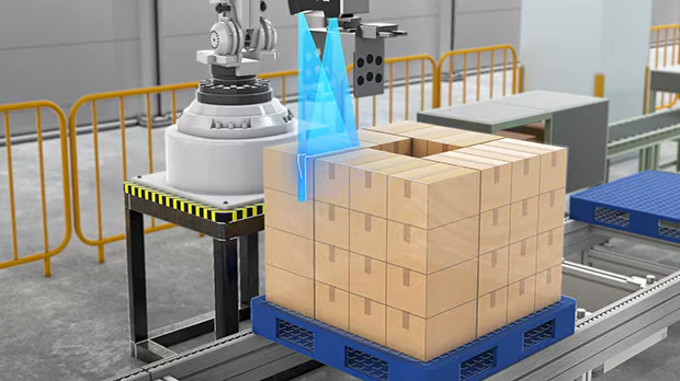 Robot paletizando paquetes con guía de un perfilómetro láser